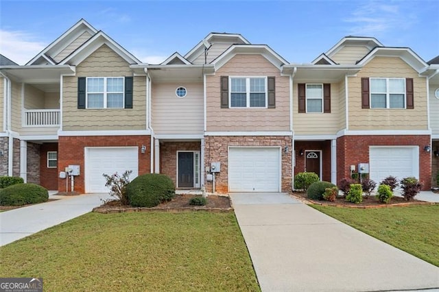 multi unit property featuring a garage and a front yard