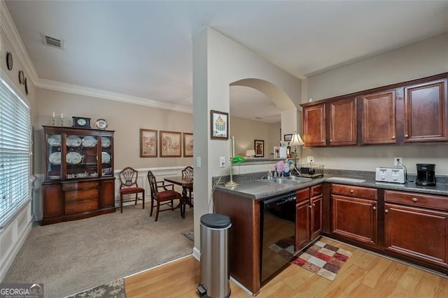 kitchen featuring light hardwood / wood-style floors, crown molding, and black dishwasher