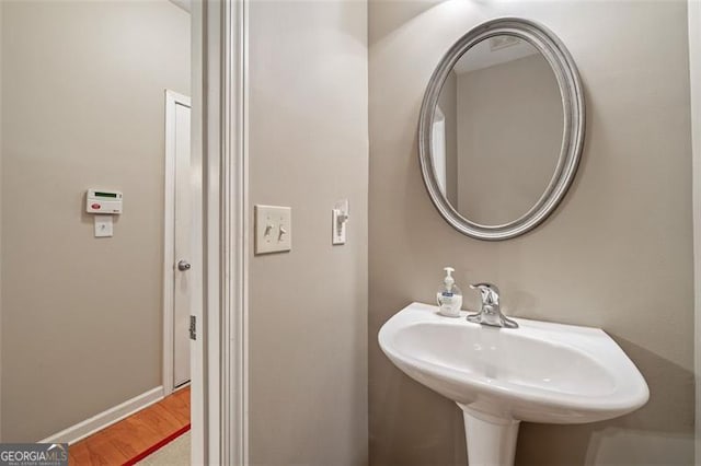 bathroom featuring hardwood / wood-style flooring and sink