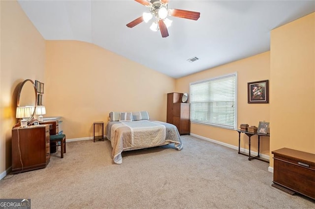 bedroom featuring lofted ceiling, ceiling fan, and light carpet