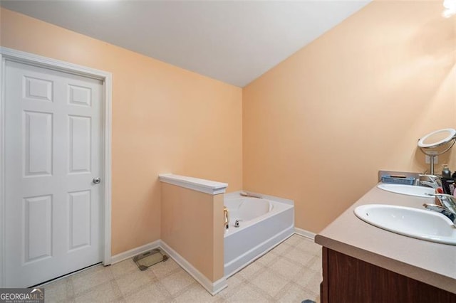 bathroom featuring vanity and a bathtub