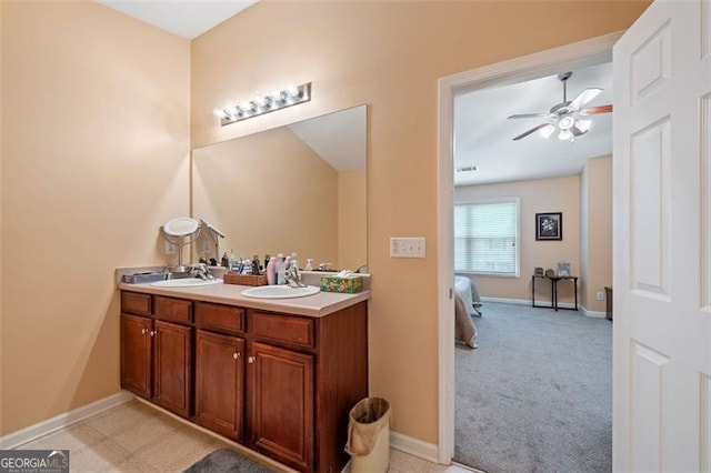 bathroom featuring ceiling fan and vanity