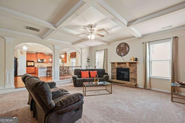 carpeted dining space featuring ornamental molding, an inviting chandelier, beam ceiling, and coffered ceiling