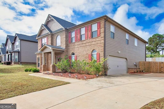 craftsman house featuring concrete driveway, an attached garage, fence, a front lawn, and brick siding