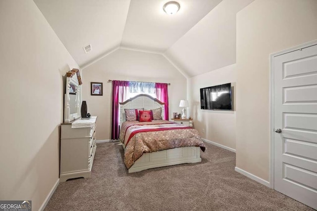 carpeted bedroom featuring baseboards, visible vents, and vaulted ceiling