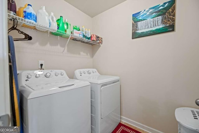 laundry room with washer and dryer, laundry area, and baseboards