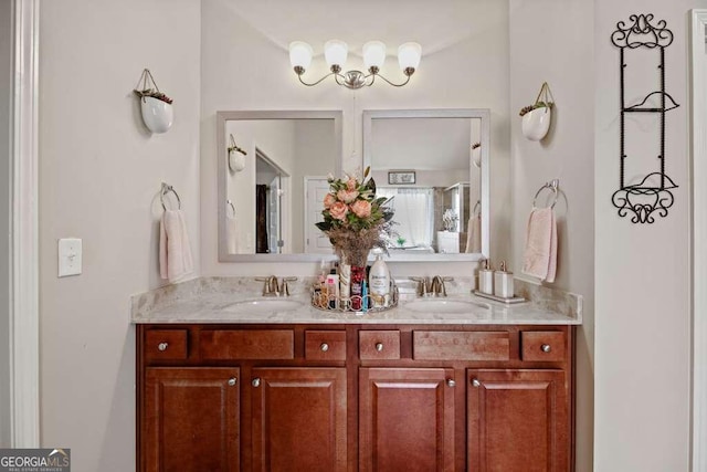 full bath with double vanity and a sink