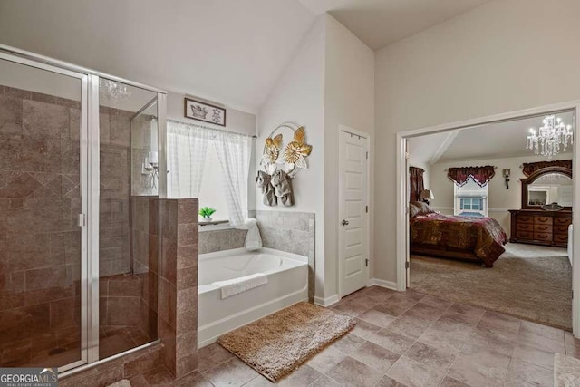 bathroom featuring independent shower and bath, a chandelier, and vaulted ceiling