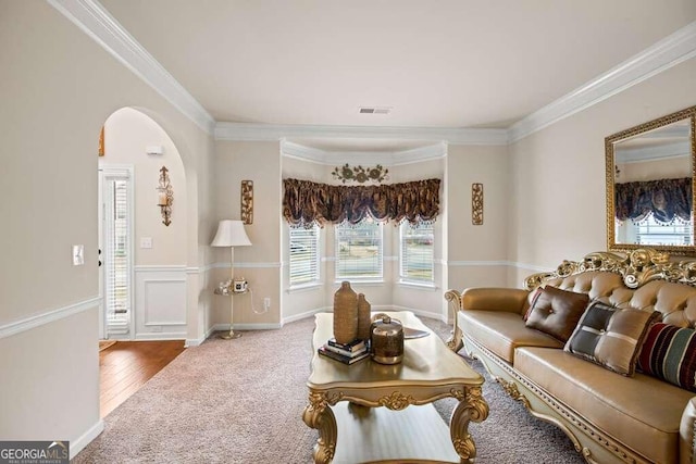 living room featuring hardwood / wood-style floors and crown molding