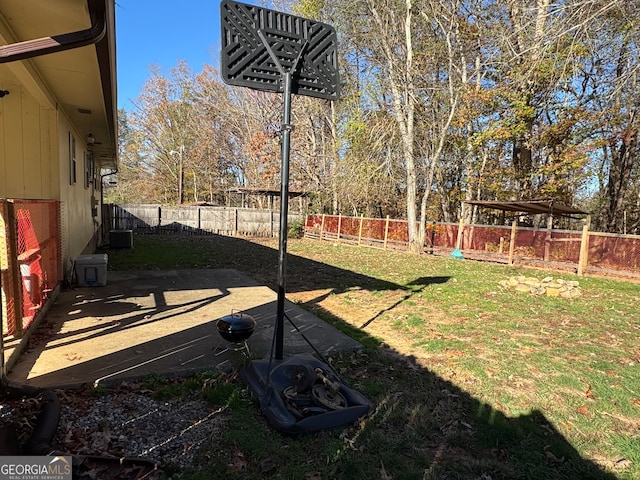 view of yard featuring central AC unit and a patio area