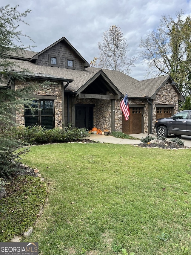 330 E Second St, Blue Ridge, GA 30513 - view of front of home featuring stone siding, a shingled roof, a garage, and a front yard