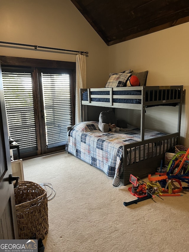 bedroom with lofted ceiling, carpet, and wooden ceiling