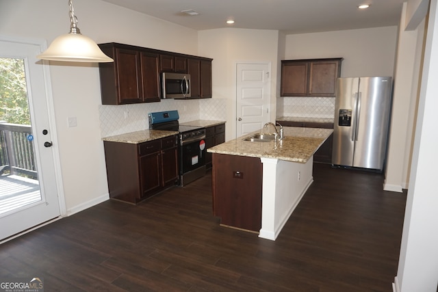 kitchen featuring stainless steel appliances, backsplash, dark hardwood / wood-style floors, light stone countertops, and sink