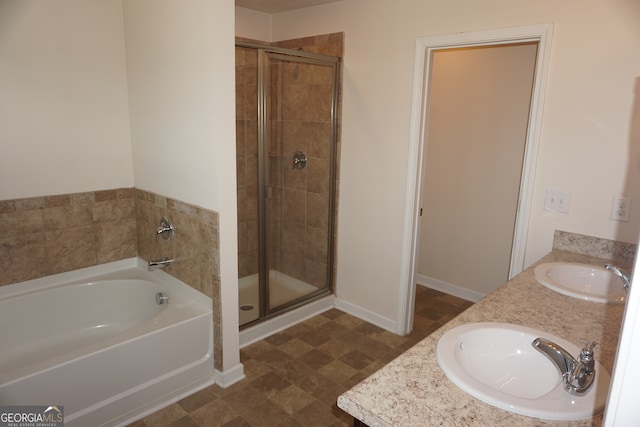 bathroom with vanity and separate shower and tub