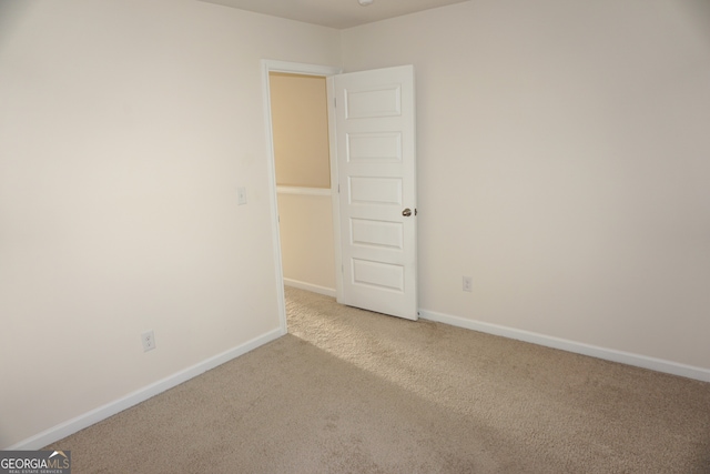 empty room featuring carpet floors