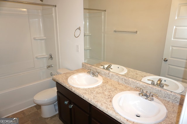 full bathroom with shower / bathing tub combination, tile patterned flooring, vanity, and toilet