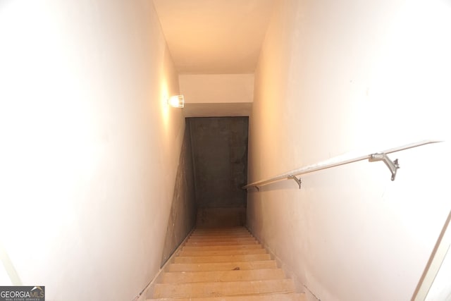 stairway featuring hardwood / wood-style floors