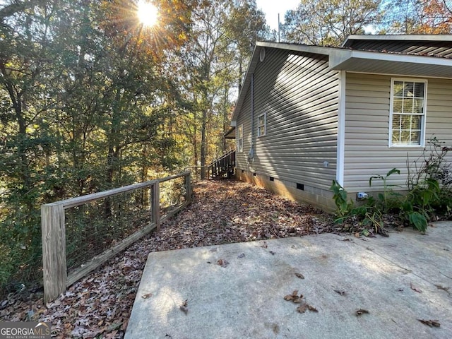 view of side of home featuring a patio area