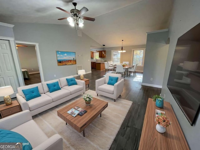 living room with hardwood / wood-style floors, ceiling fan, and lofted ceiling