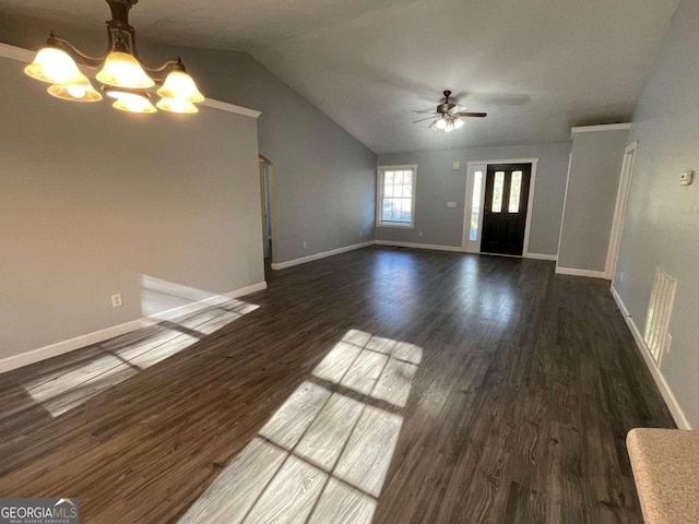 unfurnished living room with ceiling fan with notable chandelier, lofted ceiling, and dark hardwood / wood-style floors