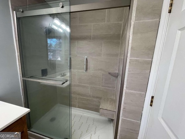 bathroom with a shower with shower door