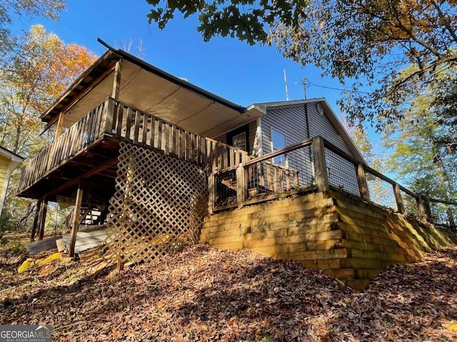 view of home's exterior with a wooden deck