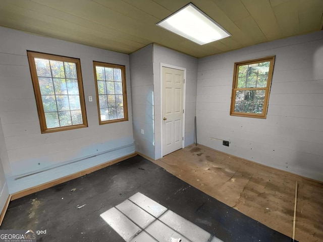 spare room featuring concrete flooring