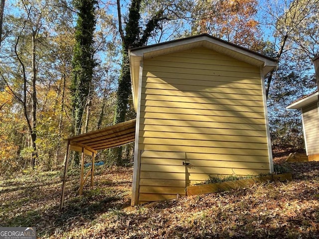 view of property exterior featuring a carport