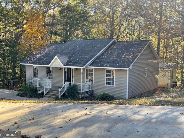 ranch-style home featuring a porch