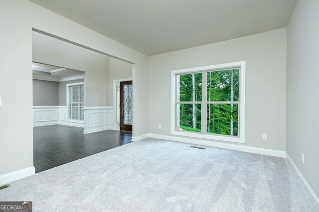 foyer featuring dark hardwood / wood-style flooring, a chandelier, and a high ceiling