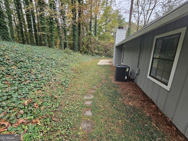 view of yard featuring central AC unit