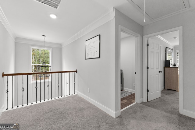 hallway with light colored carpet and crown molding