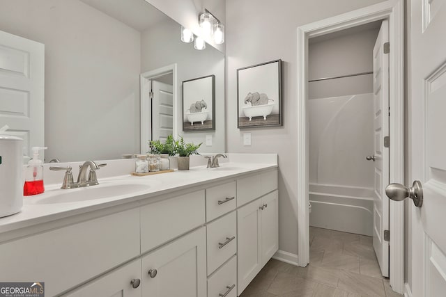 bathroom featuring vanity, tile patterned flooring, and  shower combination