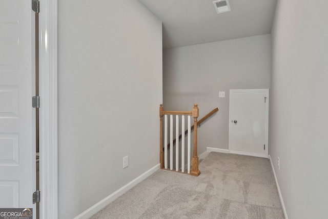 interior space featuring light colored carpet