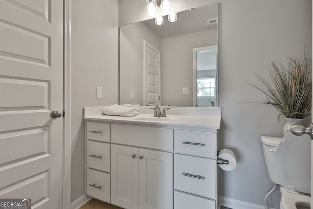 bathroom with vanity and toilet