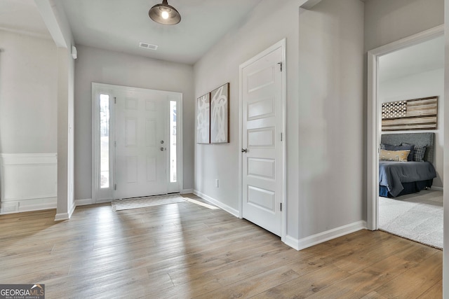 entryway with light hardwood / wood-style floors