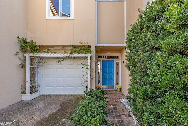 entrance to property featuring a garage