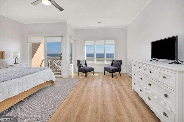 bedroom with light wood-type flooring, ceiling fan, and crown molding