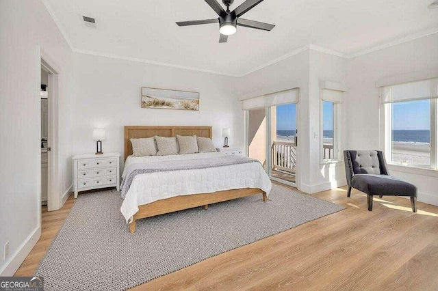 bedroom with access to outside, ceiling fan, crown molding, a water view, and light hardwood / wood-style floors