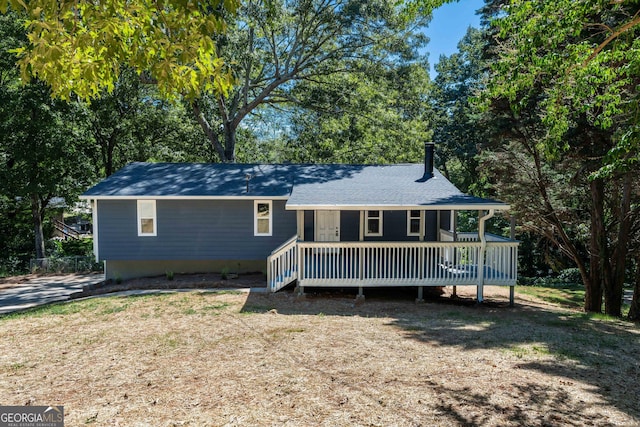 ranch-style home featuring a wooden deck