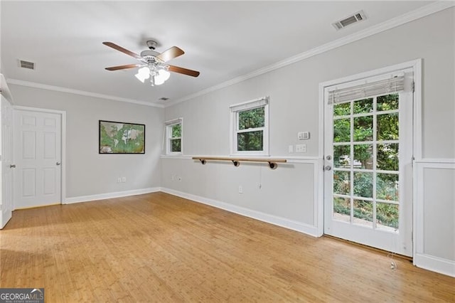 empty room with light hardwood / wood-style floors, ceiling fan, and a healthy amount of sunlight