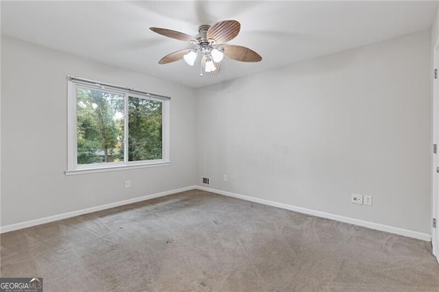 empty room with light carpet and ceiling fan