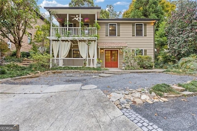 view of front of house featuring french doors and ceiling fan