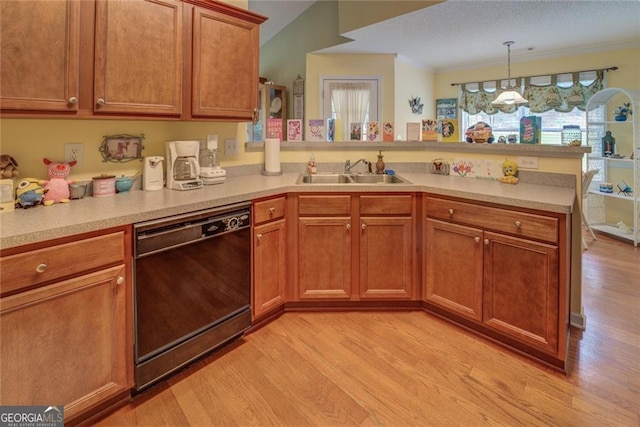 kitchen featuring light hardwood / wood-style flooring, sink, hanging light fixtures, black dishwasher, and kitchen peninsula