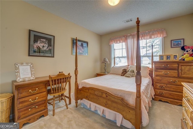 carpeted bedroom with a textured ceiling