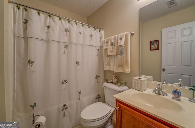 full bathroom with vanity, toilet, shower / bath combination with curtain, and a textured ceiling