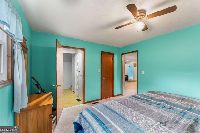 carpeted bedroom with ceiling fan