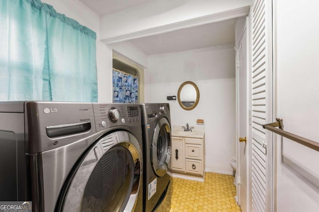 washroom featuring separate washer and dryer and sink