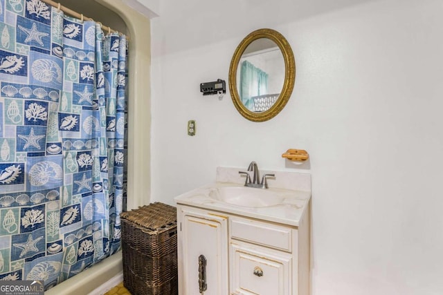 bathroom with vanity and walk in shower