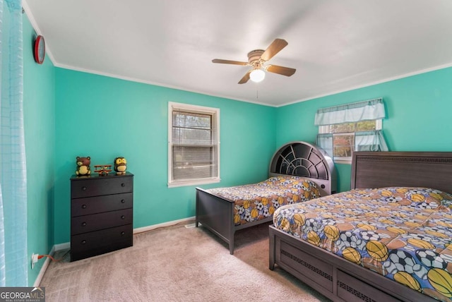 carpeted bedroom featuring ceiling fan, crown molding, and multiple windows